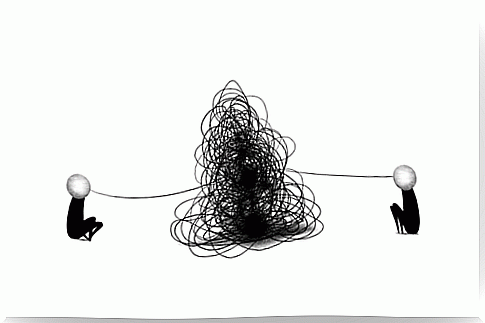 People tied together by a tangle of thread