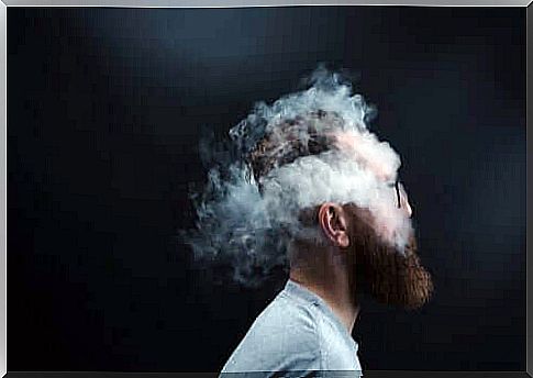 Man surrounded by smoke.