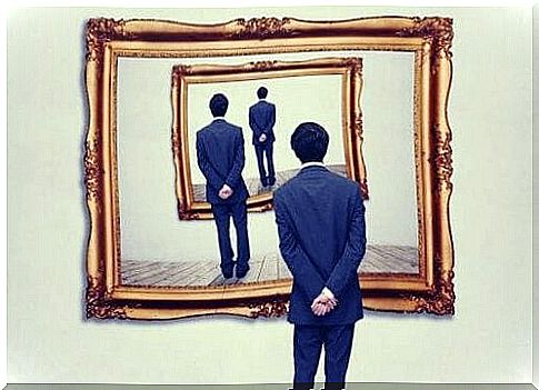 Man in front of mirror.