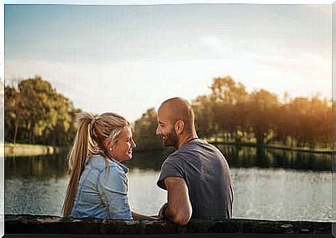 Man sitting with woman.