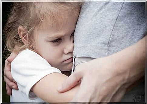 A girl with separation anxiety who hugs her parent hard.