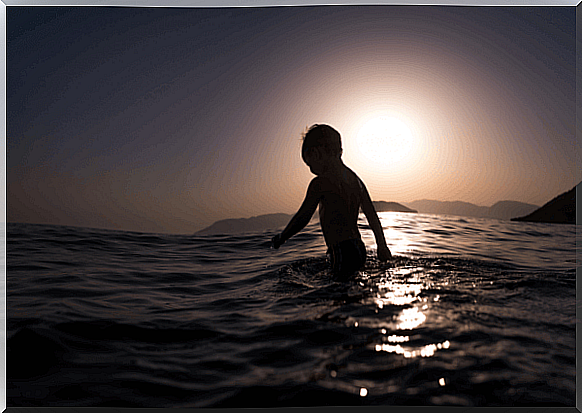 A little boy bathing in the sea