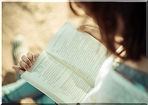 Woman reading book.