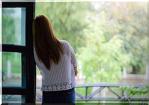 A woman looking out of a window