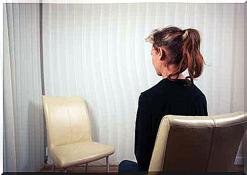 A person talking to a chair.