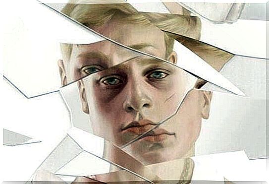 Sad man's face in broken mirror