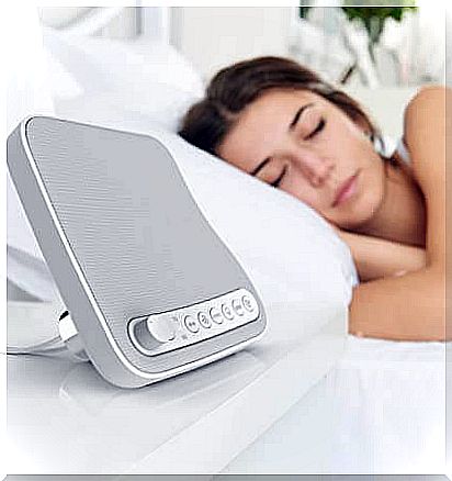 White noise can help people sleep better: A woman who sleeps using a white noise machine.